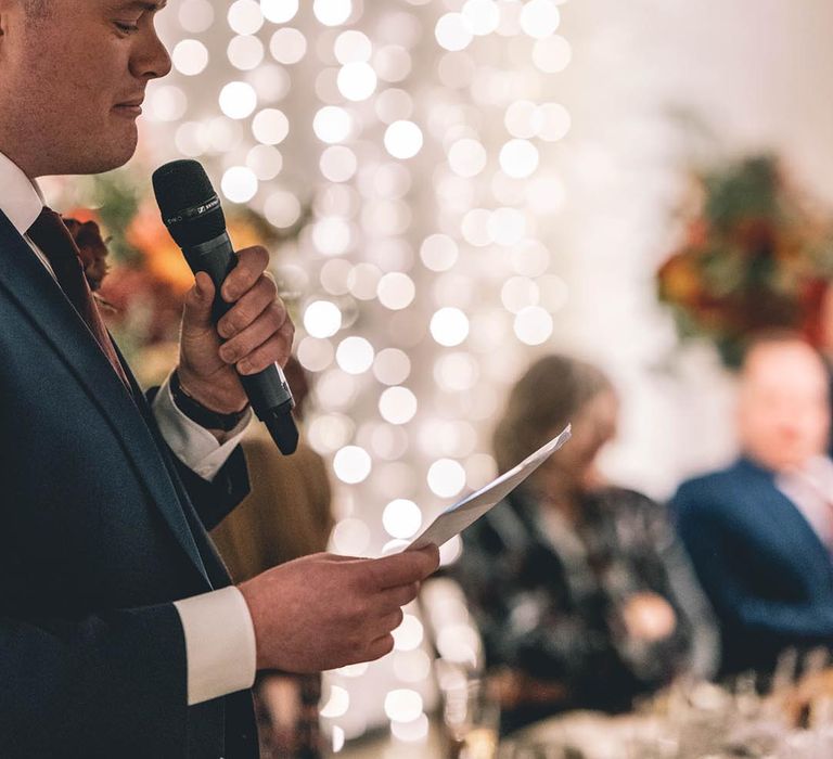 Wedding speeches with fairy light back drop