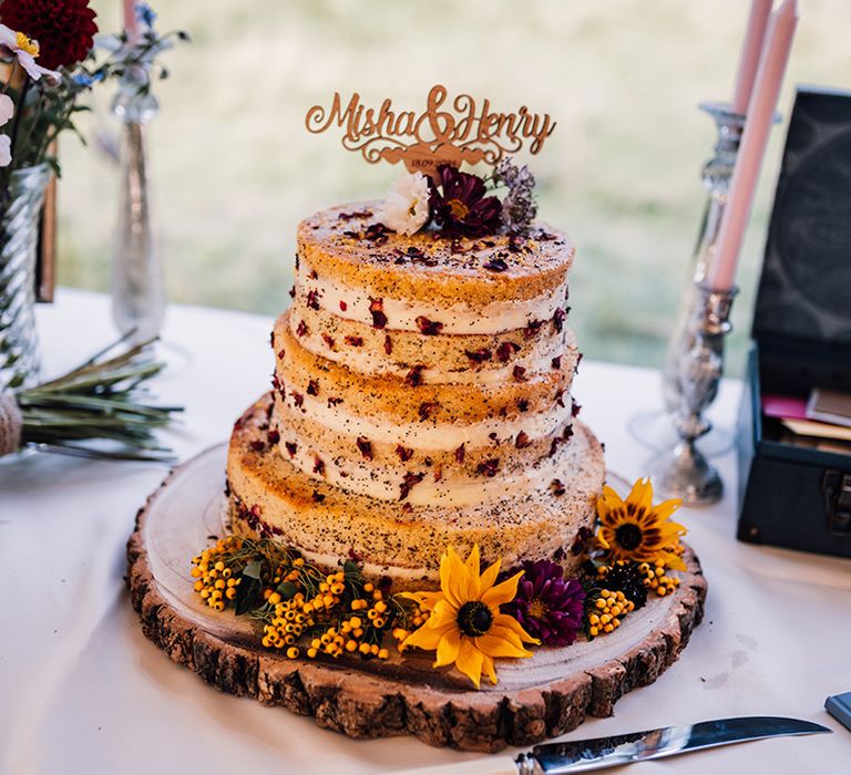 Rustic styled wedding cake complete with floral decoration