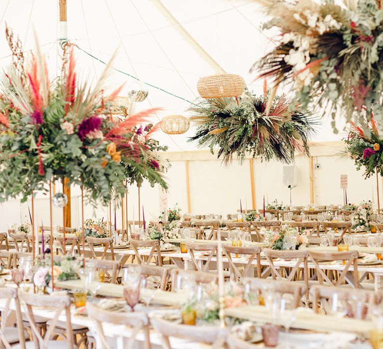 Beautiful hanging flower decoration at marquee wedding