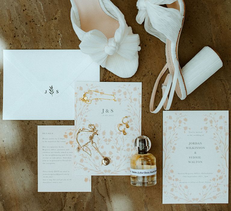 Pink, white and green wedding stationery with the white Loeffler Randall wedding shoes and perfume