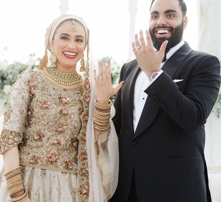 Bride & groom show off their wedding rings after Walima at the Isla Gladstone Conservatory