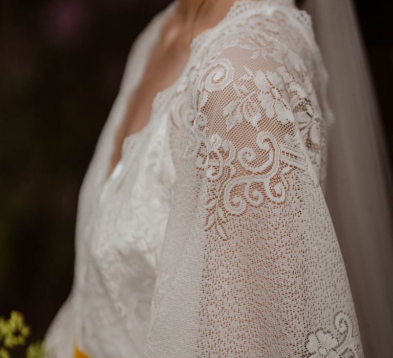 Detail on lace Kimono-style wedding dress