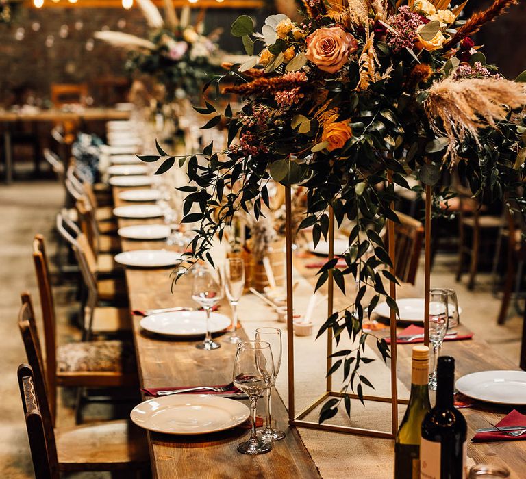 Autumnal coloured table centrepieces for boho and industrial style wedding 