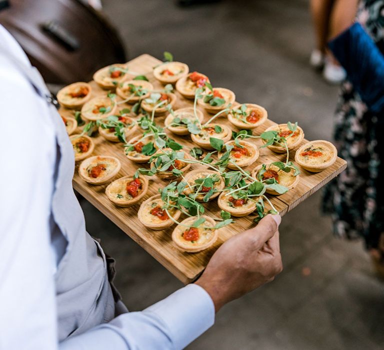 Canapés on wooden board for industrial styled wedding 