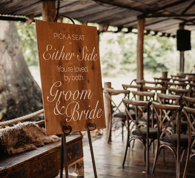 Rustic styled wedding signage on easel at The Dreys wedding venue for barn ceremony 