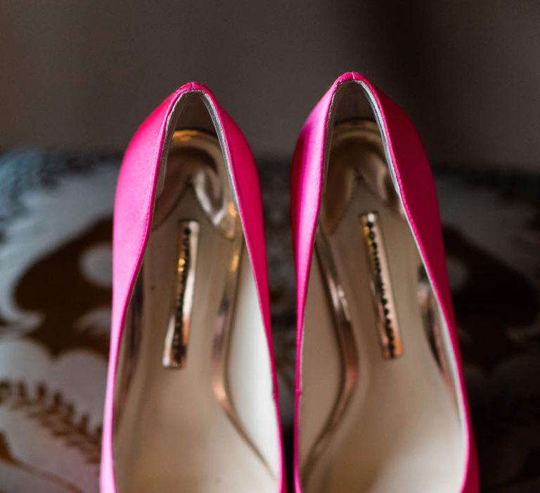 Pink leather wedding shoes with blue, canary yellow, and white jewels 