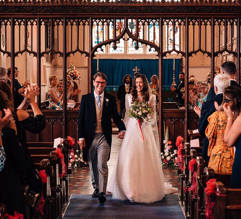 Traditional church wedding in the groom's hometown with hymns and songs 