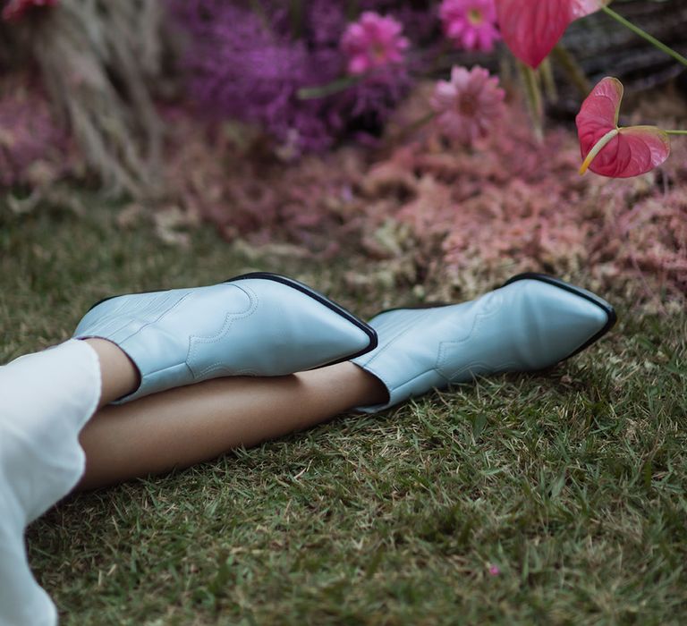 Bride wearing baby blue pointed boots for the wedding day 