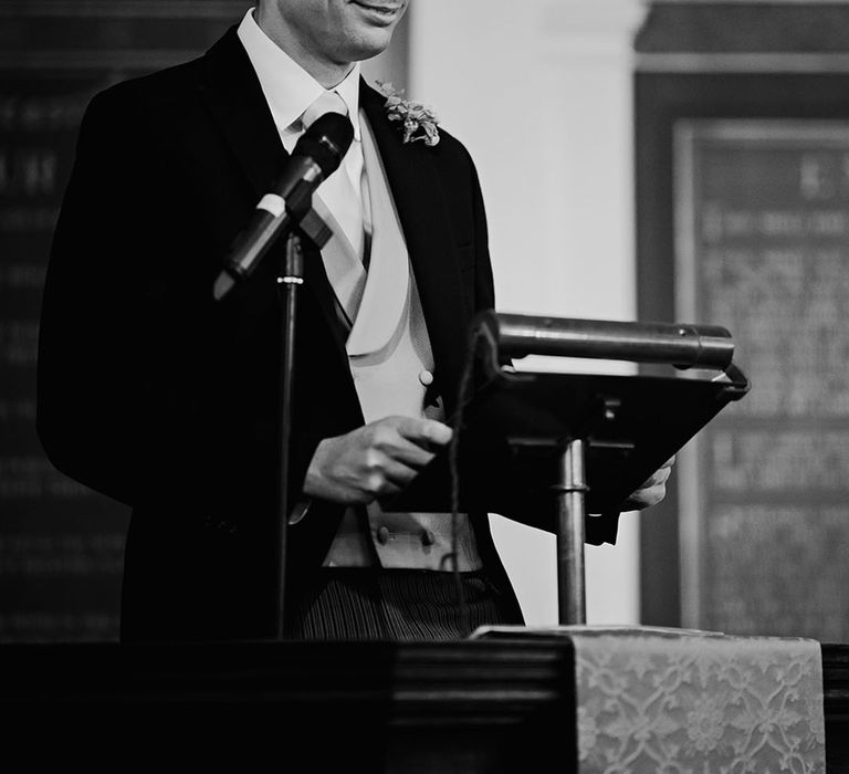 Wedding guest performs wedding reading at church wedding ceremony 