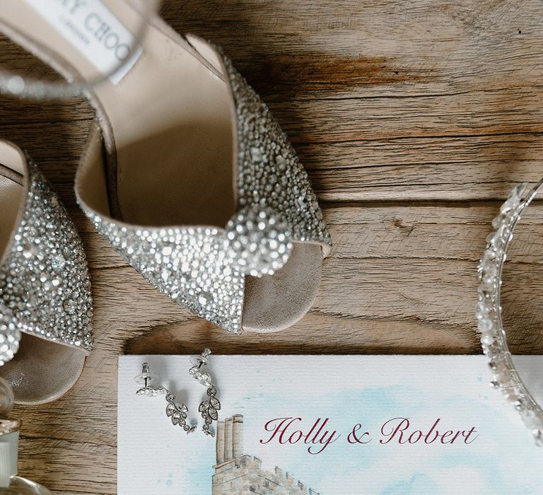 Sparkly Jimmy Choo wedding shoes with watercolour painted wedding stationery 