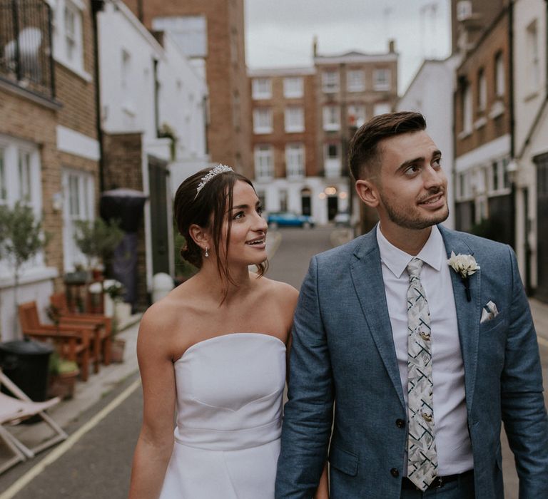 Bride in strapless Roland Mouret dress at intimate London wedding 