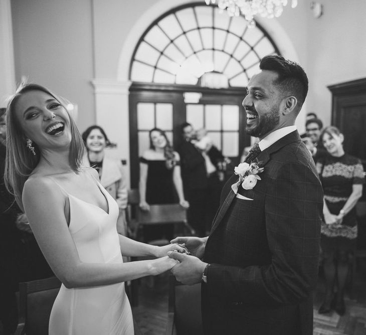 Bride and Groom Laughing with Black and White Photography at City Hall London 