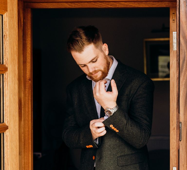 Groom getting ready on wedding morning