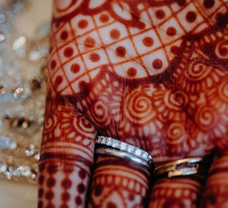 Close up of brides palms featuring intricate Henna