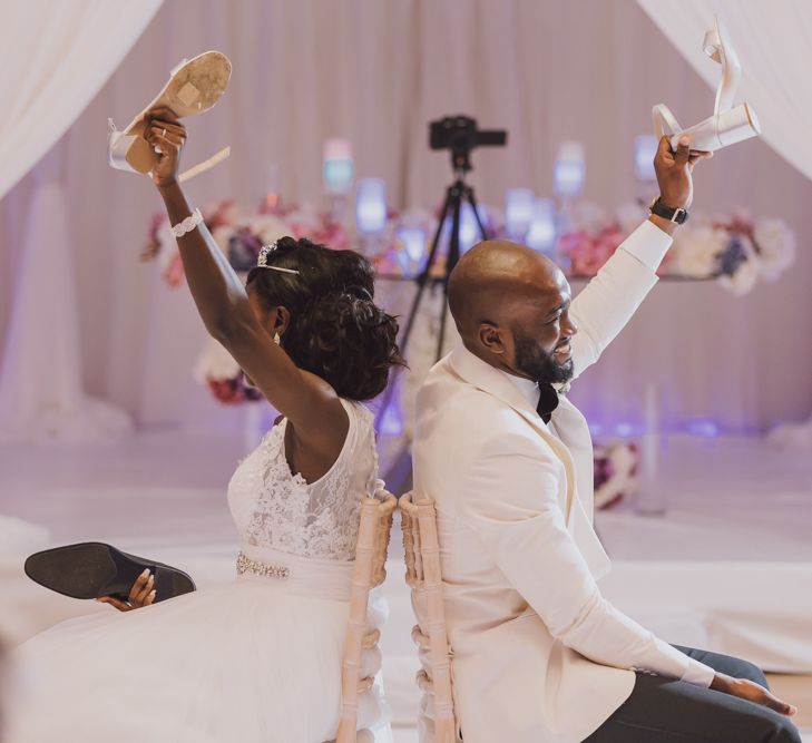 A bride and groom play the Mr and Mrs game at their wedding.