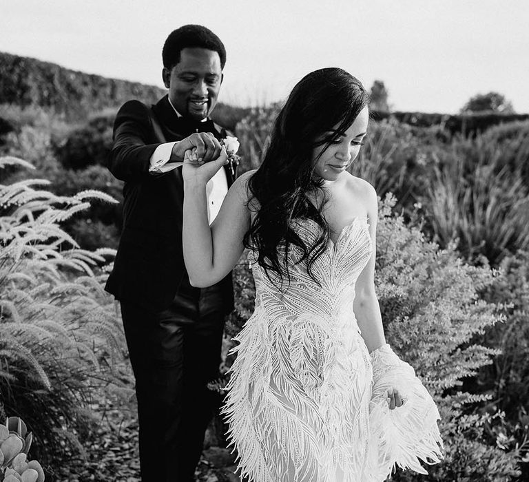 Bride in a strapless feather wedding dress 