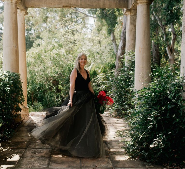 Vera Wang black wedding dress with tropical bouquet