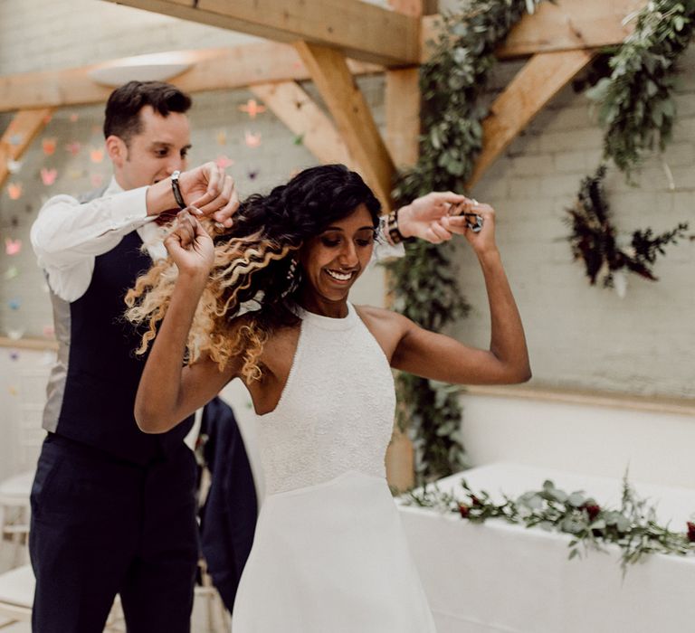 Groom spins his bride around on their wedding day | Joshua Gooding Photography