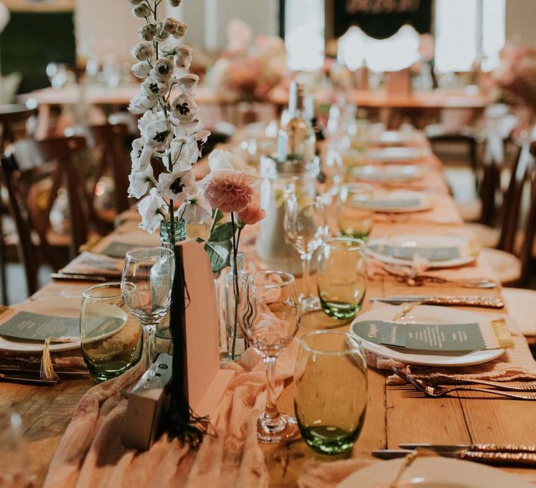 Rustic and retro tablescape complete with disposable cameras and pastel florals