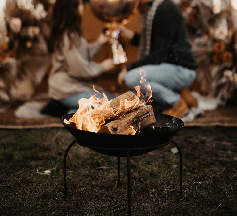 Fire pit at boho marriage proposal at The Cherry Barn