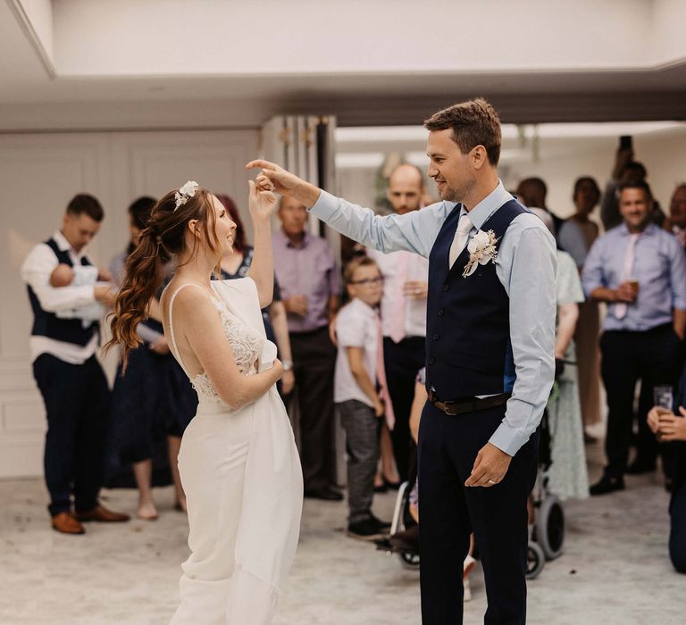 Bride & groom dance during wedding reception 