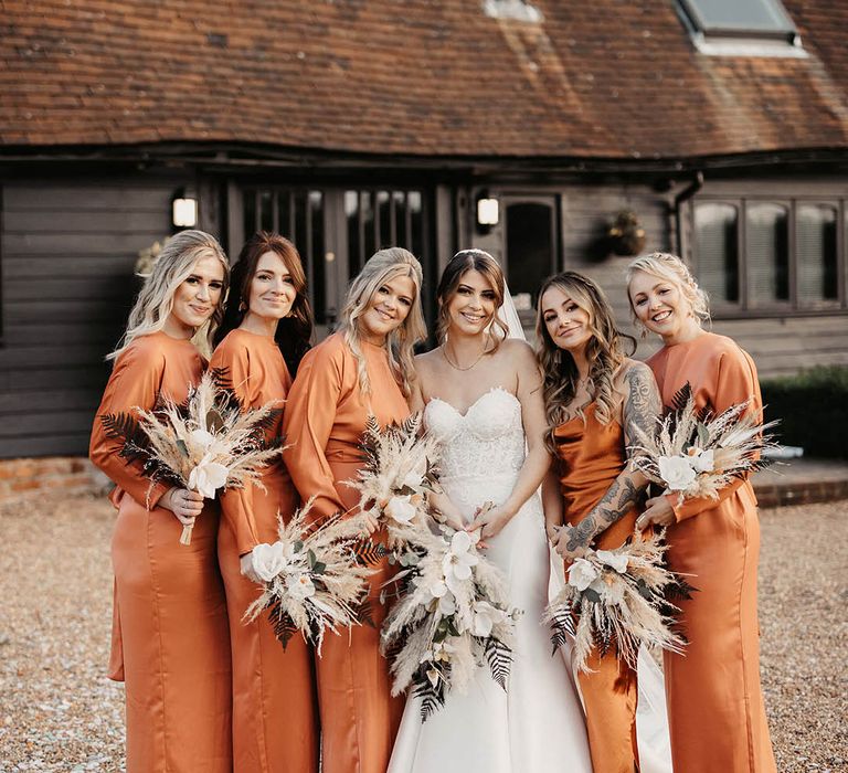 Burnt orange bridesmaid dresses for November wedding