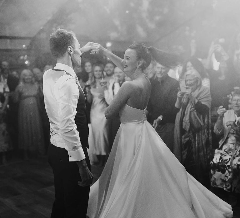 Bride and groom share their first dance together 