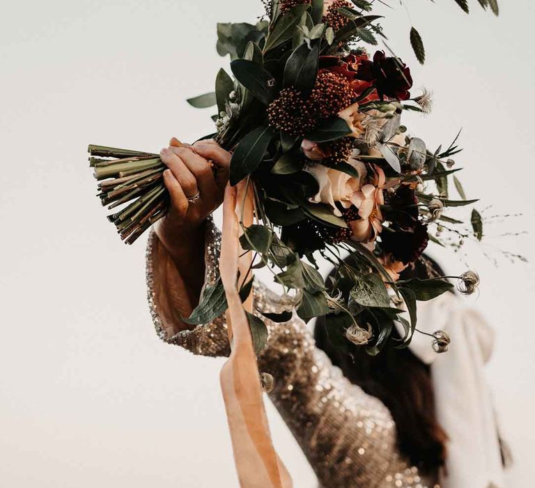 Mixed neutral bouquet with garden roses, carnations, peonies, eucalyptus, baby's-breath and dried flowers tied with mustard velvet ribbon 