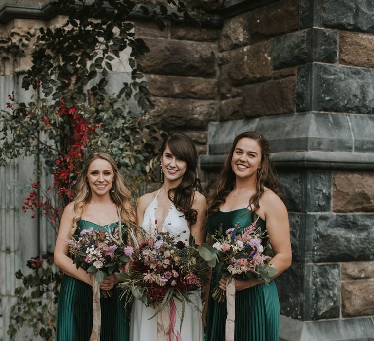 Small bridal party in pleated dark green satin bridesmaid dresses 