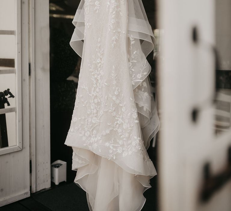 Nicole Milano tulle wedding dress with appliqué design 