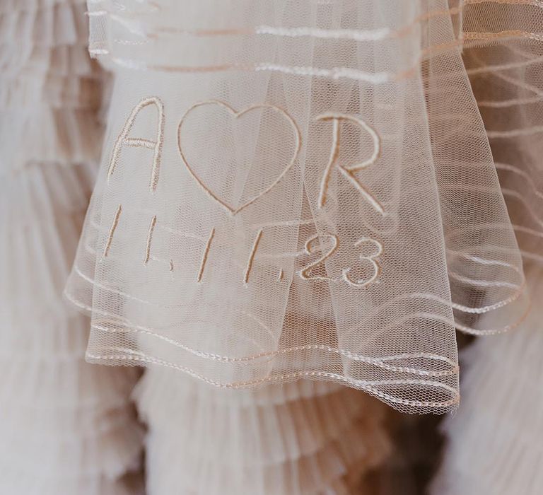 Embroidered personalised wedding veil with the bride and groom's initials 