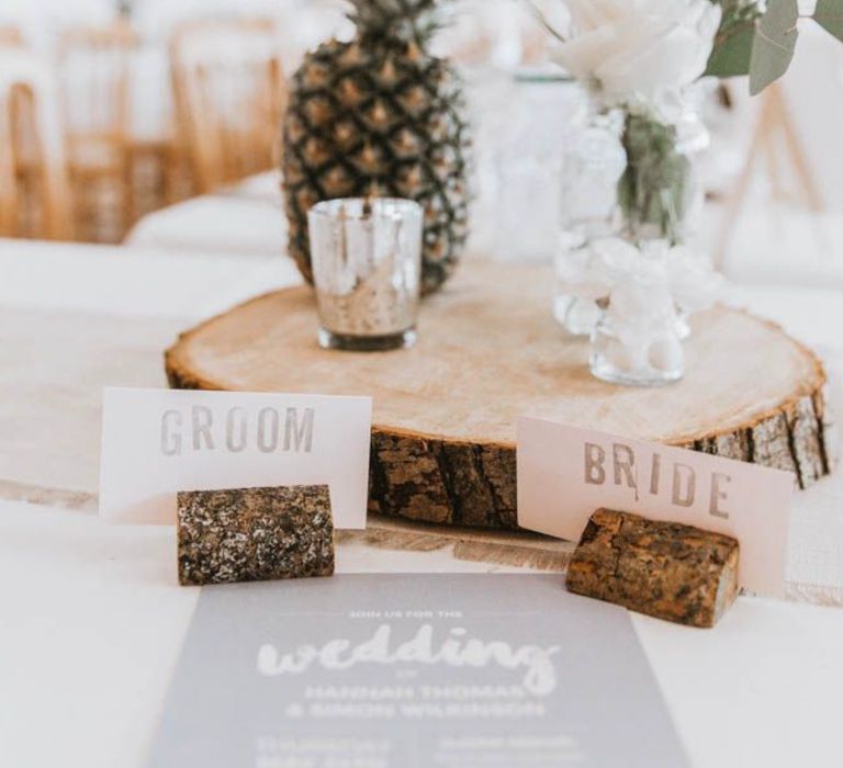 DIY wedding centrepieces on wood slice and with pineapple