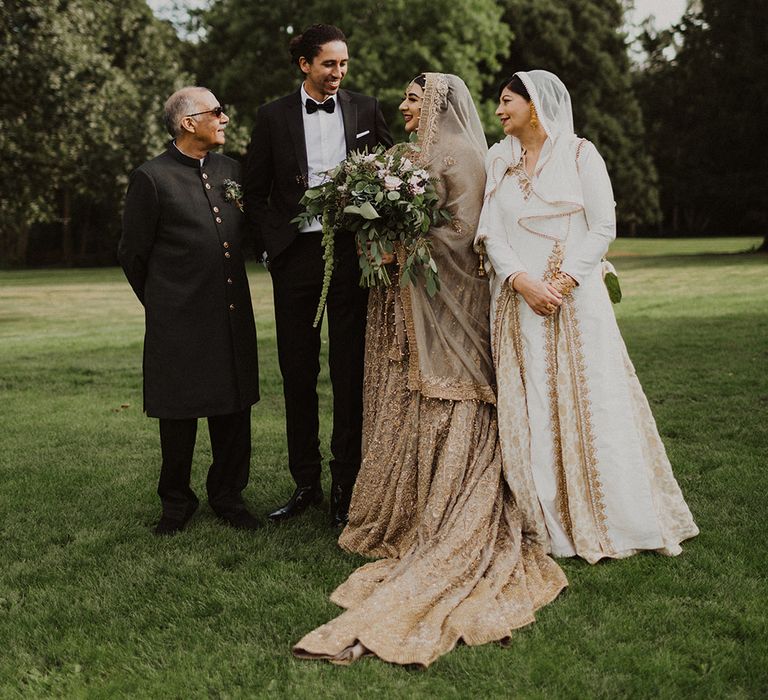 Portrait of the bride and groom with the brides parents 