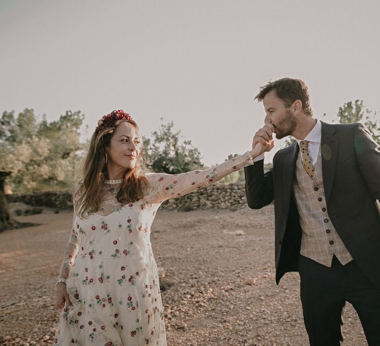 Bride and groom in boho chic wedding outfits