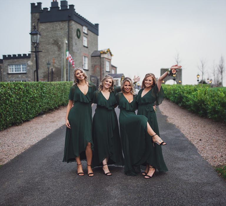 Dark green groomsman dresses with frill and wrap detail at Darver Castle wedding 