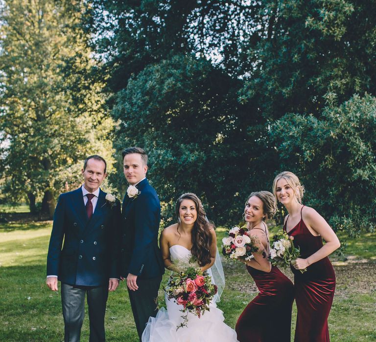 Bride and groom with their wedding party for autumnal wedding in London