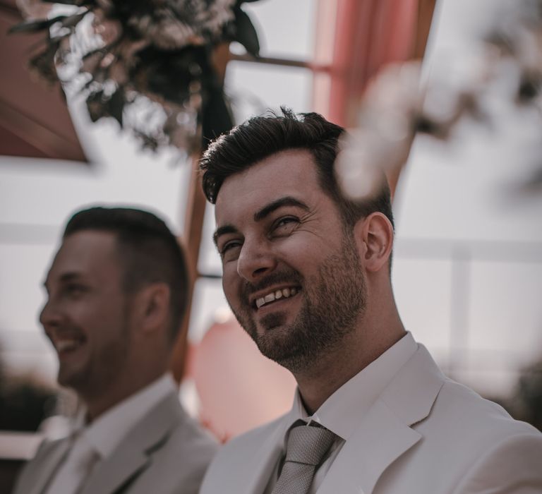 Light grey wedding suit for grooms at gay wedding