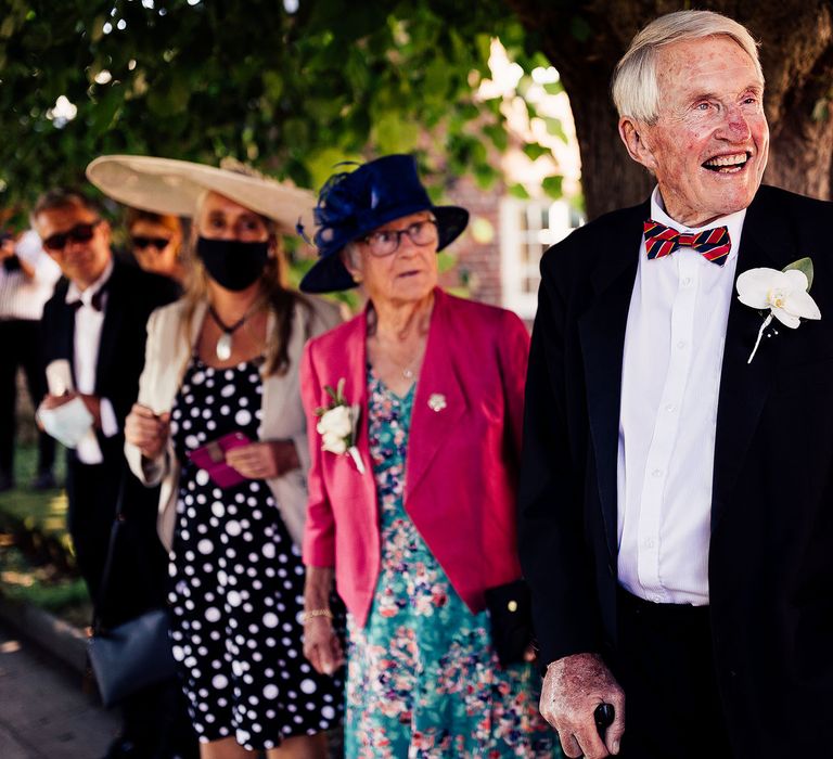 Wedding guests smile at Lea Manor farm wedding