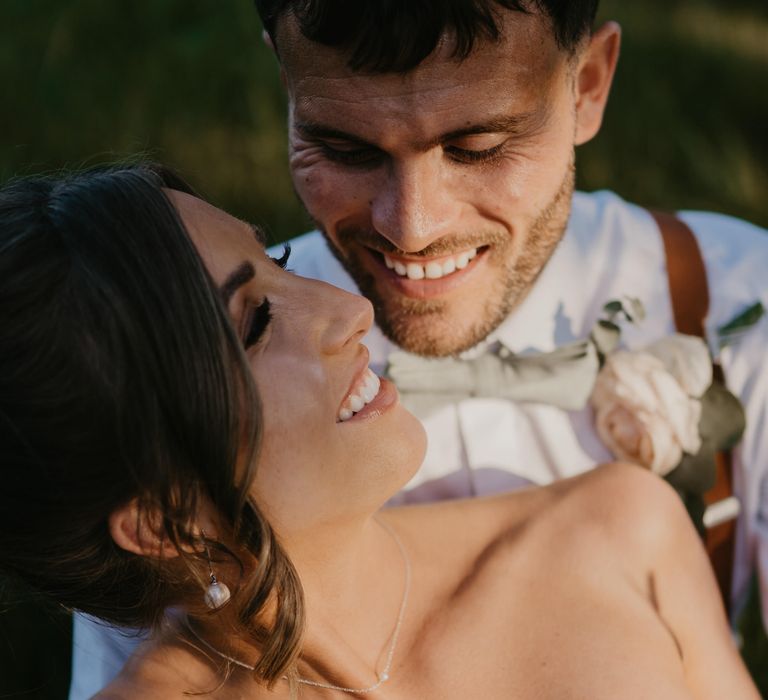 Bride looks back lovingly at her groom on her wedding day  | Mark Bamforth Photography