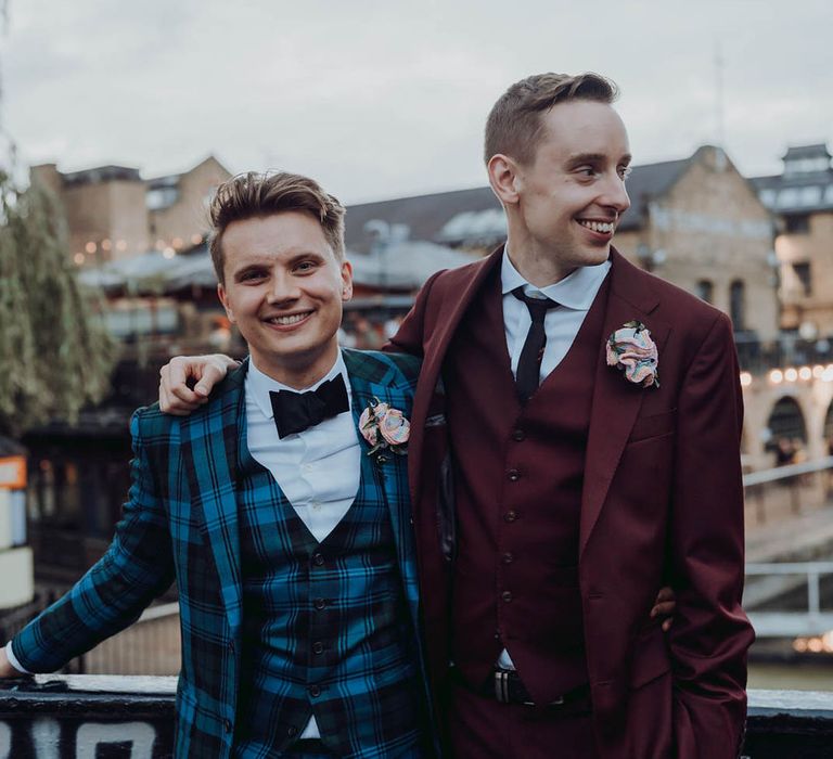 Grooms stand on balcony on their wedding day  | Kim Williams Weddings