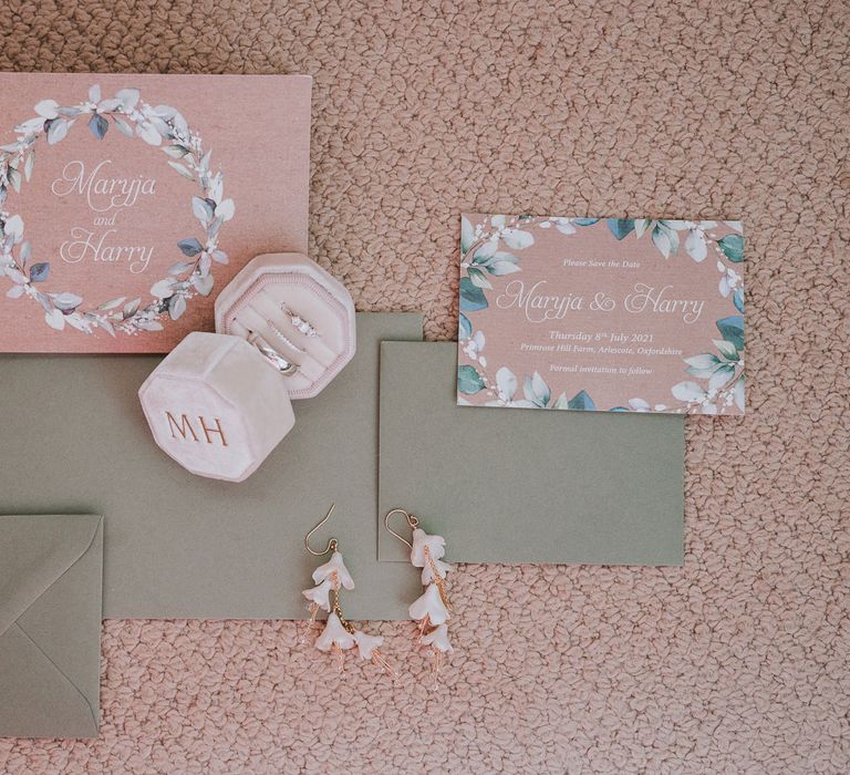 Pink and green wedding stationery with pink velvet pin box and floral drop earrings for summer wedding at Primrose Hill Farm