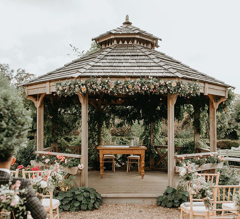 The Secret Garden wedding venue in Kent complete with pergola and pastel florals