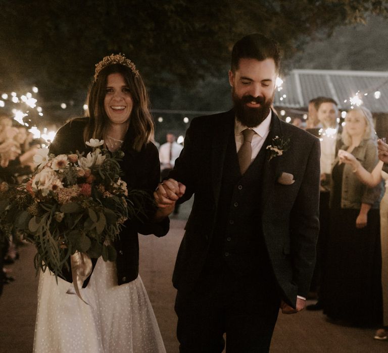 Bride & groom walk through sparkler exit on their wedding day