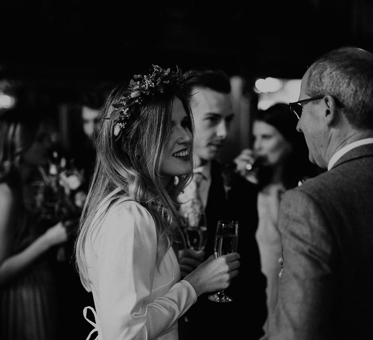 Bride speaks to wedding guests on wedding day