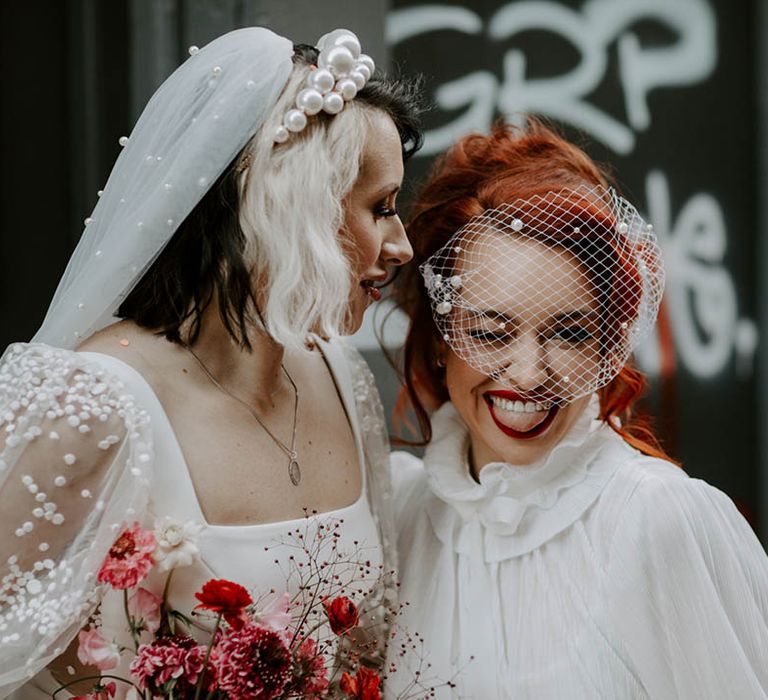 Two brides in a pearl headband and birdcage veil at Manchester elopement 