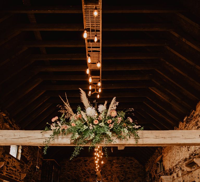 Bright orange autumnal wedding flower display for rustic wedding at Cardney Estate venue in Scotland