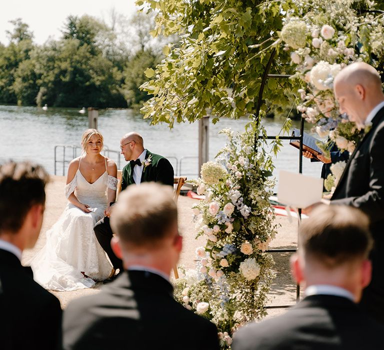 Bride & groom during outdoor wedding ceremony on the bank of the River Thames