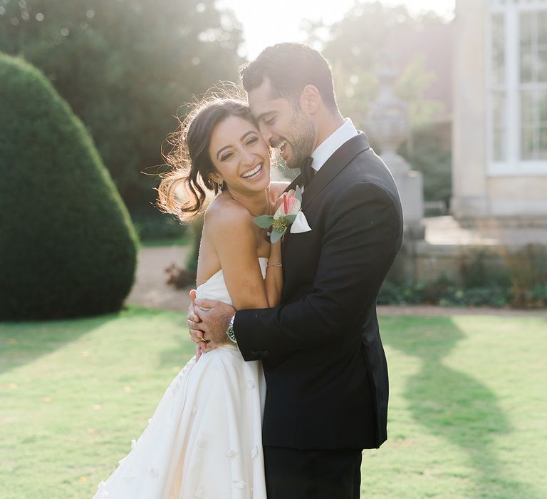 Bride & groom during couples portraits outdoors at Syon Park