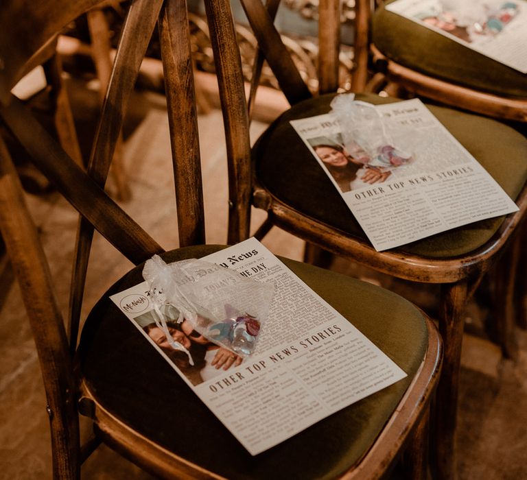 Personalised wedding newspaper order of the day with see through bag of confetti for each guest on the chairs 