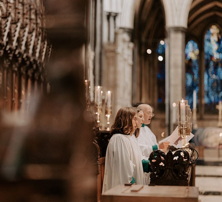 A church choir sings at the traditional church ceremony of Sarah and James